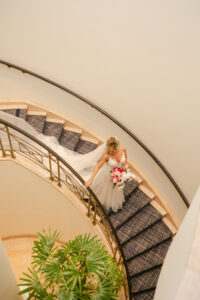 Bride Walking Down Spiral Staircase with Full Length Veil