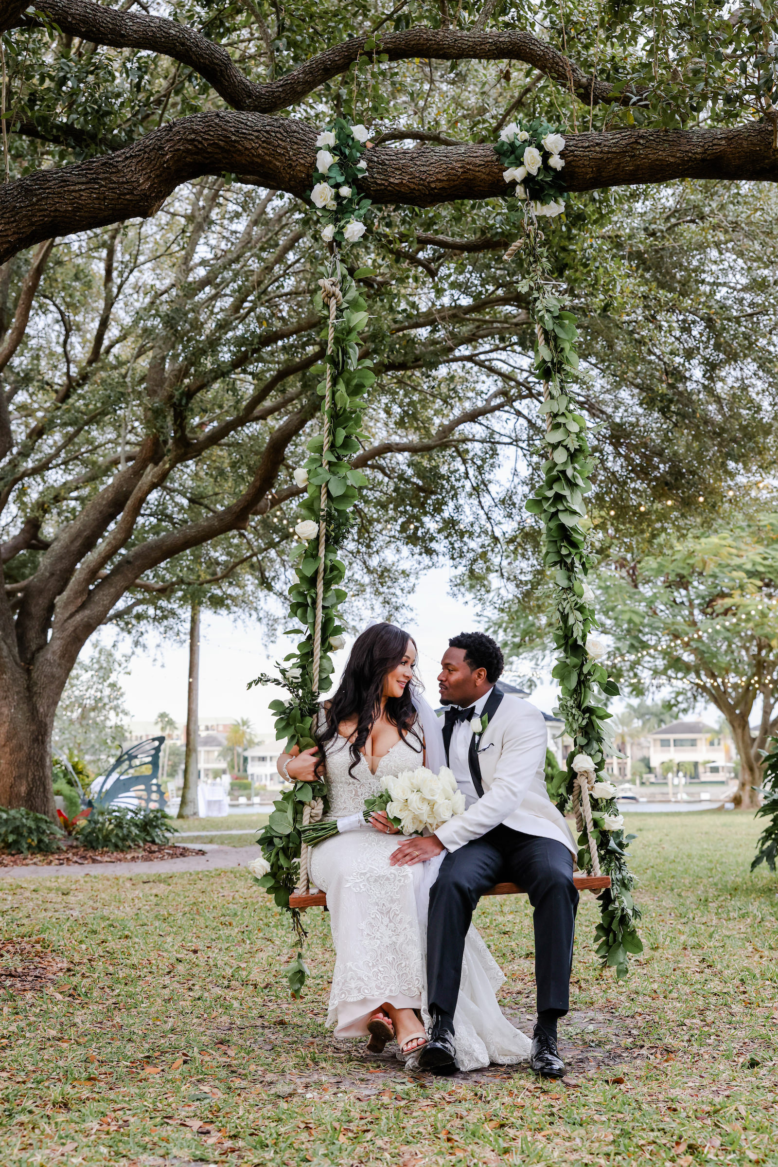 Modern Romantic Glam Bride and Groom Sitting on Swing Hanging on Tree | Tampa Bay Wedding Photographer Lifelong Photography Studio