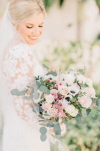 Bride with Pale Pink White and Greenery Floral Wedding Bouquet | St. Pete Makeup Artist Femme Akoi | Planner Breezin' Weddings