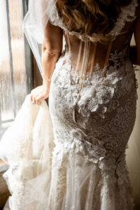 Fall Boho Bride Getting Wedding Ready Wearing Delicate Floral Lace Applique, Tulle and Illusion Open Back Wedding Dress