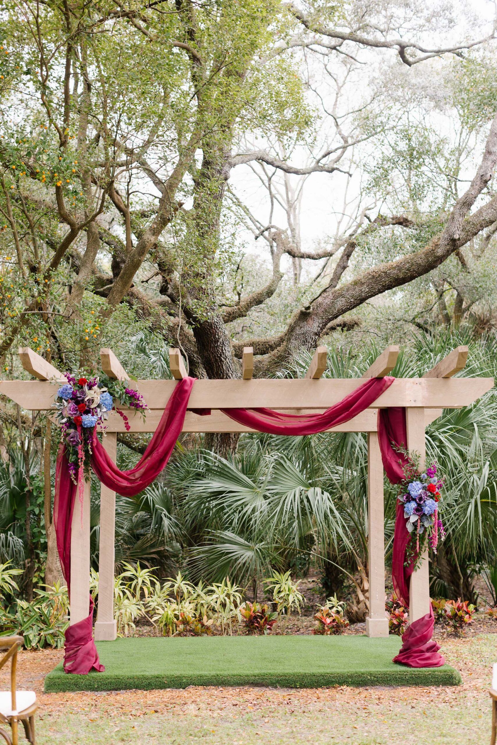 Wedding Alter with Burgundy Draping and Blue and Indigo Floral | Tampa Wedding Planner Perfecting the Plan Weddings and Events