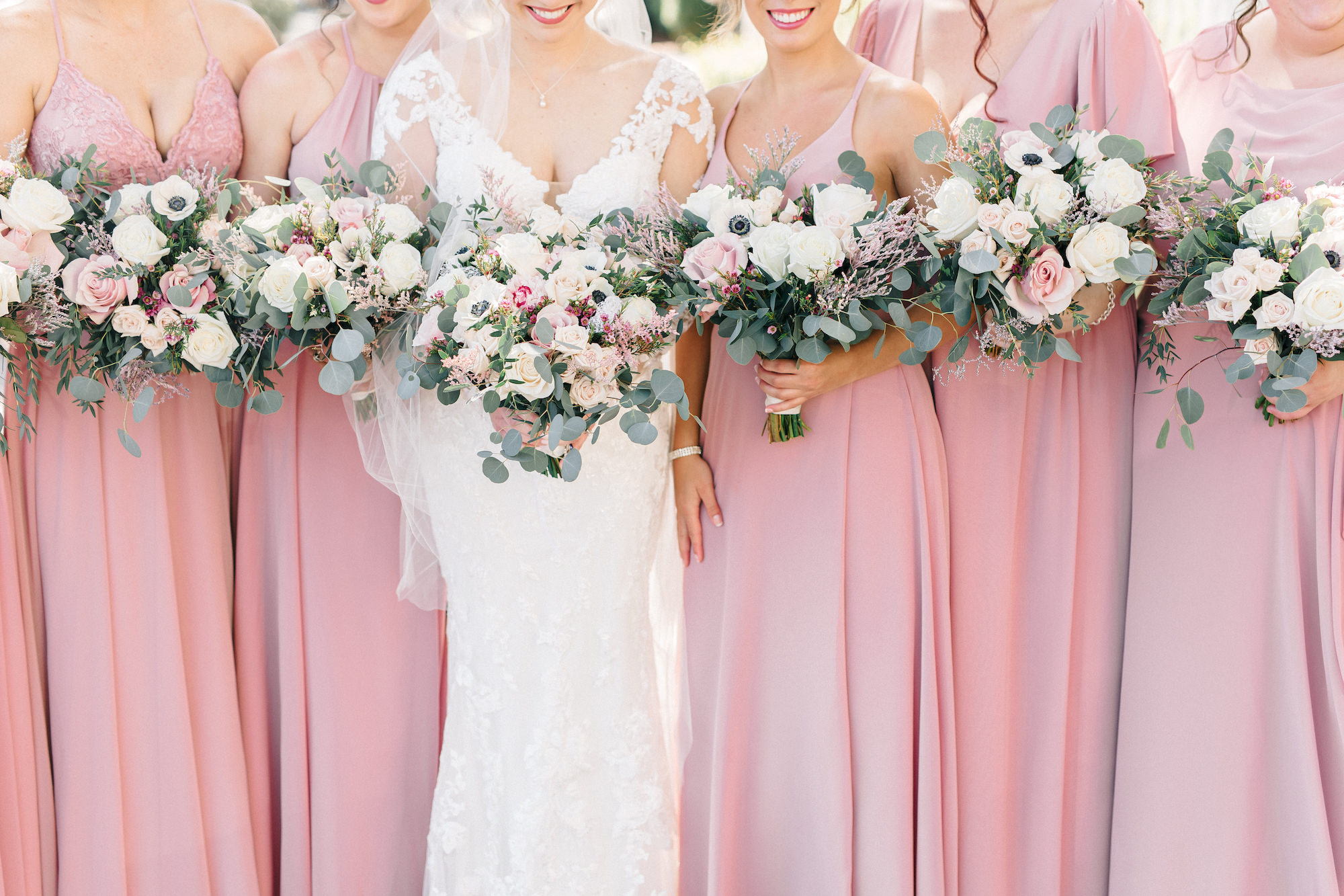 Bride and Bridesmaids in Dusty Pink Floor Length Bridesmaids Dresses with White and Blush Bouquets Inspiration