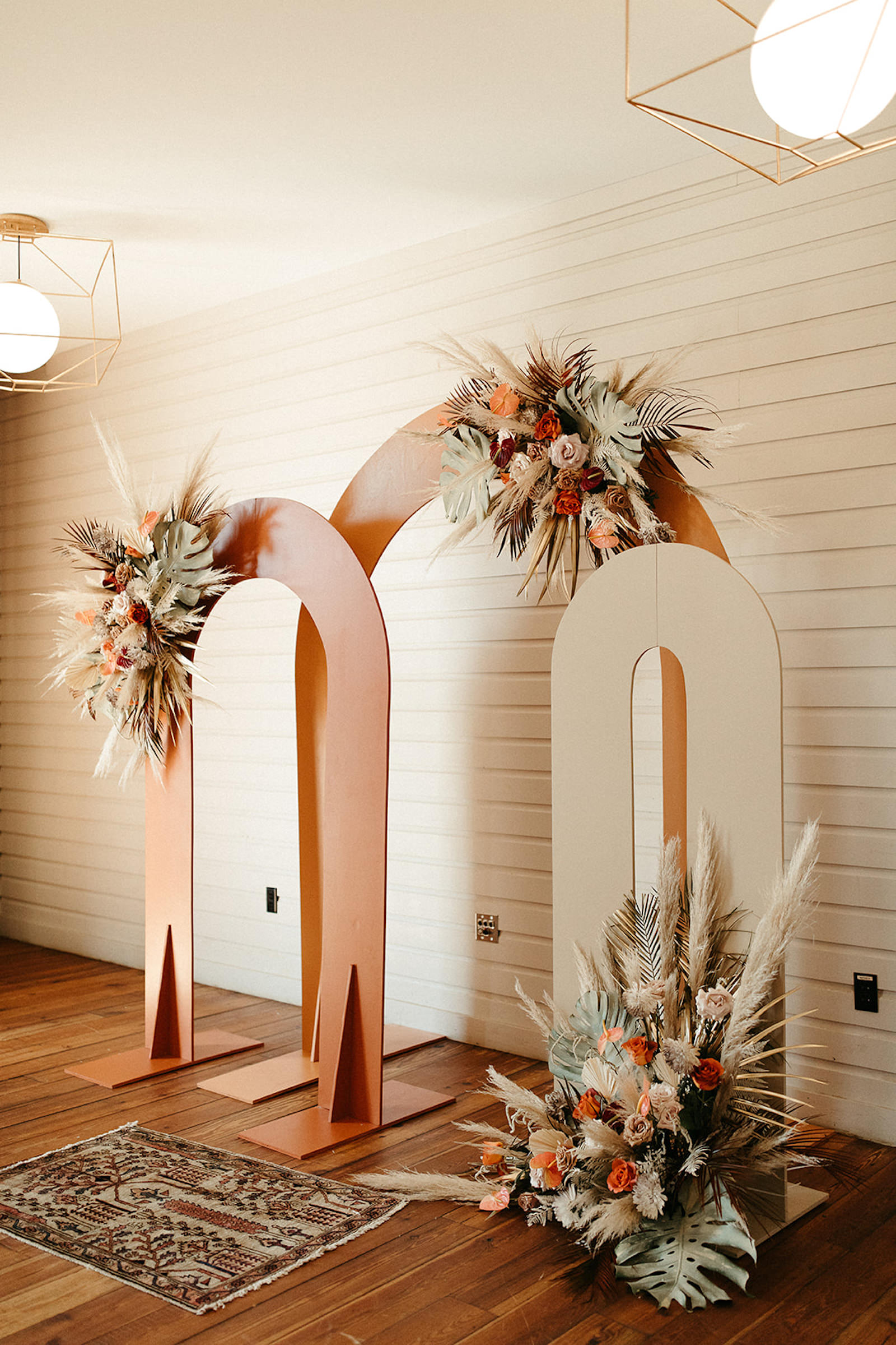 Earthy Neutral Boho Modern Chic Wedding Ceremony Decor, Arched Terracotta and Cream Panels with Lush Floral Bouquets | Tampa Bay Wedding Florist Save the Date Florist | Wedding Planner Wilder Mind Events
