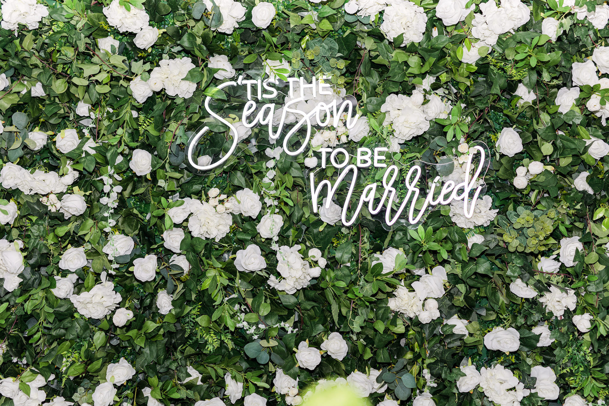 Winter Modern Whimsical Wedding Reception Decor, Greenery Wall with Lush White Roses, Hydrangeas and White "Tis the Season to Be Married" Neon Sign | Tampa Bay Wedding Planner MDP Events Planning | Wedding