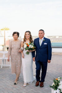 Bride Walking Down the Aisle with Mother and Father of the Bride Wedding Portrait | Wedding Hair and Makeup Artist in Florida Femme Akoi | Wedding Photographer in Florida Dewitt for Love