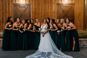 Bride with Bridesmaids in Deep Green Floor Length Bridesmaids Dresses Wedding Portrait | Florida Hair and Makeup Femme Akoi