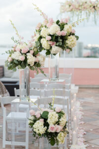 Elegant Blush Pink Same Sex Wedding Ceremony Decor, Acrylic Pedestals with Glass Vases and Lush Floral Arrangements, Pink and Ivory Roses, White Hydrangeas, Greenery Leaves | Tampa Bay Wedding Photographer Amanda Zabrocki Photography | Wedding Florist Save the Date Florida | Clearwater Wedding Planner Elegant Affairs by Design