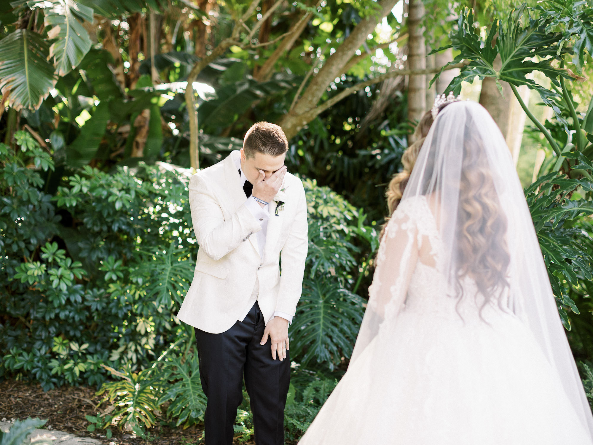 Royal Glam Gatsby Bride and Groom Wearing White Tuxedo Jacket First Look Wedding Portrait