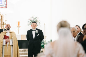 Groom Sees Bride for First Time Walking Down the Aisle Wedding Portrait