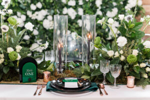 Winter Modern Whimsical Wedding Reception Styled Shoot Tablescape Wedding Decor, Glass Cylinders with Black Candlesticks, Acrylic Black and Emerald Arched Table Numbers, Black Dining Plates, Lush Greenery and White Roses, Anemone Floral Centerpieces | Tampa Bay Wedding Planner MDP Events Planning