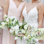 Modern Romantic Bridal Party Wearing Mix and Match Blush Pink Dresses Holding White and Mauve Roses with Greenery Floral Bouquets | Tampa Bay Wedding Attire Bella Bridesmaids