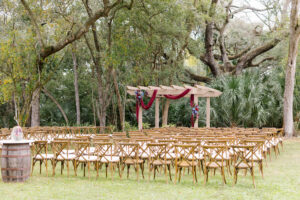 Rustic Outdoor Wedding Ceremony with Crossback Wooden Chairs in Tampa Bay | Florida Wedding Rentals Kate Ryan Rentals
