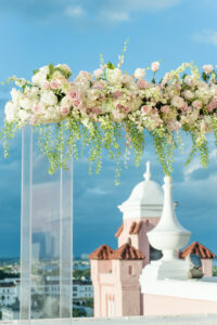 Elegant Blush Pink Same Sex Wedding, Modern Acrylic Arch with Lush Floral Arrangement, Hanging Greenery, White Hydrangeas, Blush Pink and Ivory Roses | Tampa Bay Wedding Photographer Amanda Zabrocki Photography | Clearwater Wedding Planner Elegant Affairs by Design | Wedding Florist Save the Date Florida | Rooftop Beach Waterfront St. Pete Wedding Venue The Don CeSar