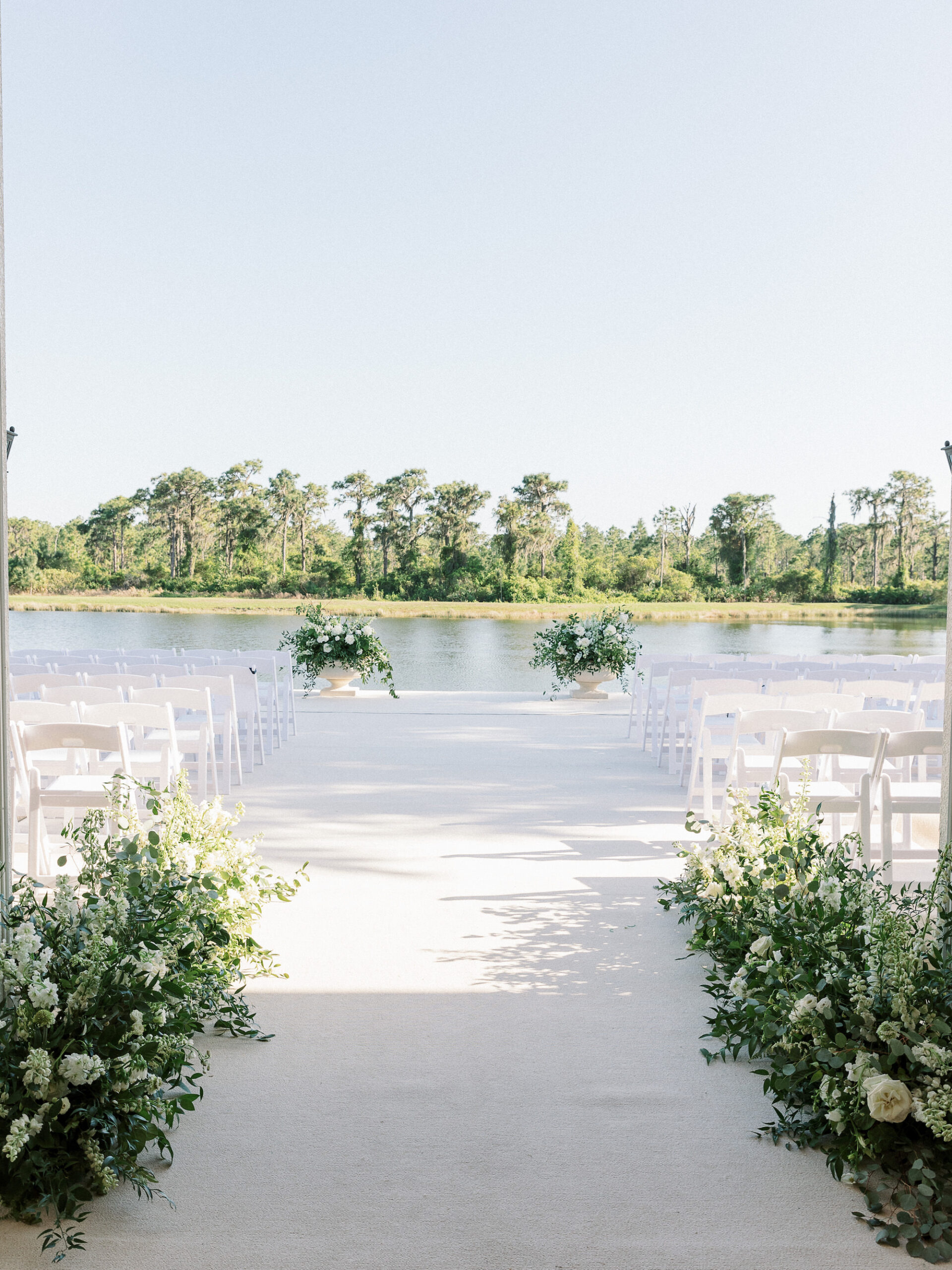 Old Florida Elegant Outdoor Waterfront Wedding Ceremony, Greenery and White Roses Floral Arrangements | Tampa Bay Wedding Venue Concession Golf Club