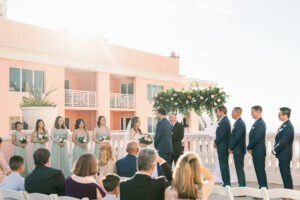 Bride and Groom Exchange Vows | Rooftop Waterfront Wedding Ceremony Hyatt Regency Clearwater Beach | Wedding Rentals Kate Ryan Event Rentals