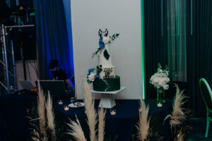 Four Tier Green and Blue Accent White Wedding Cake