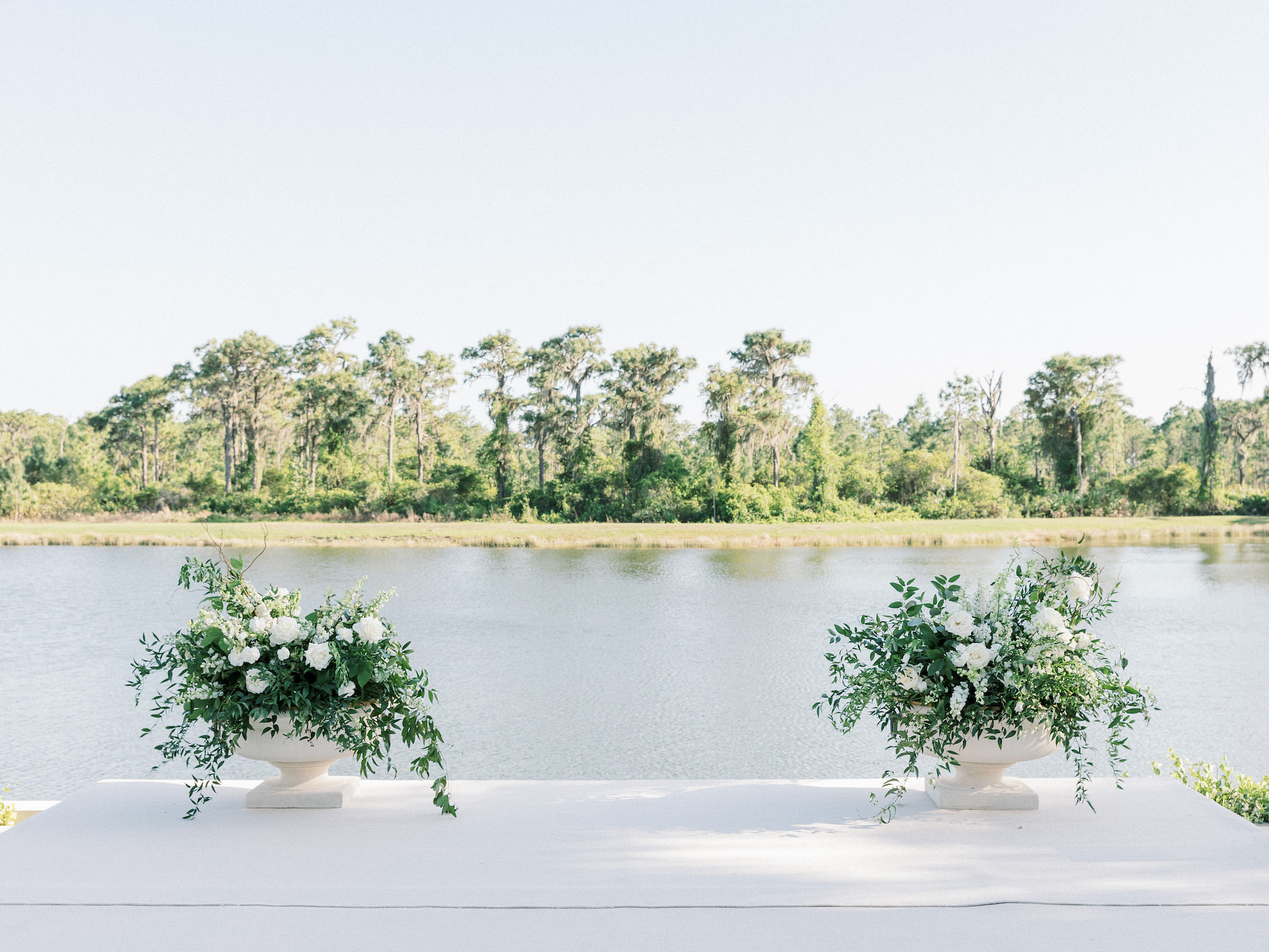 Old Florida Elegant Outdoor Waterfront Wedding Ceremony, Greenery and White Roses Floral Arrangements | Tampa Bay Wedding Venue Concession Golf Club
