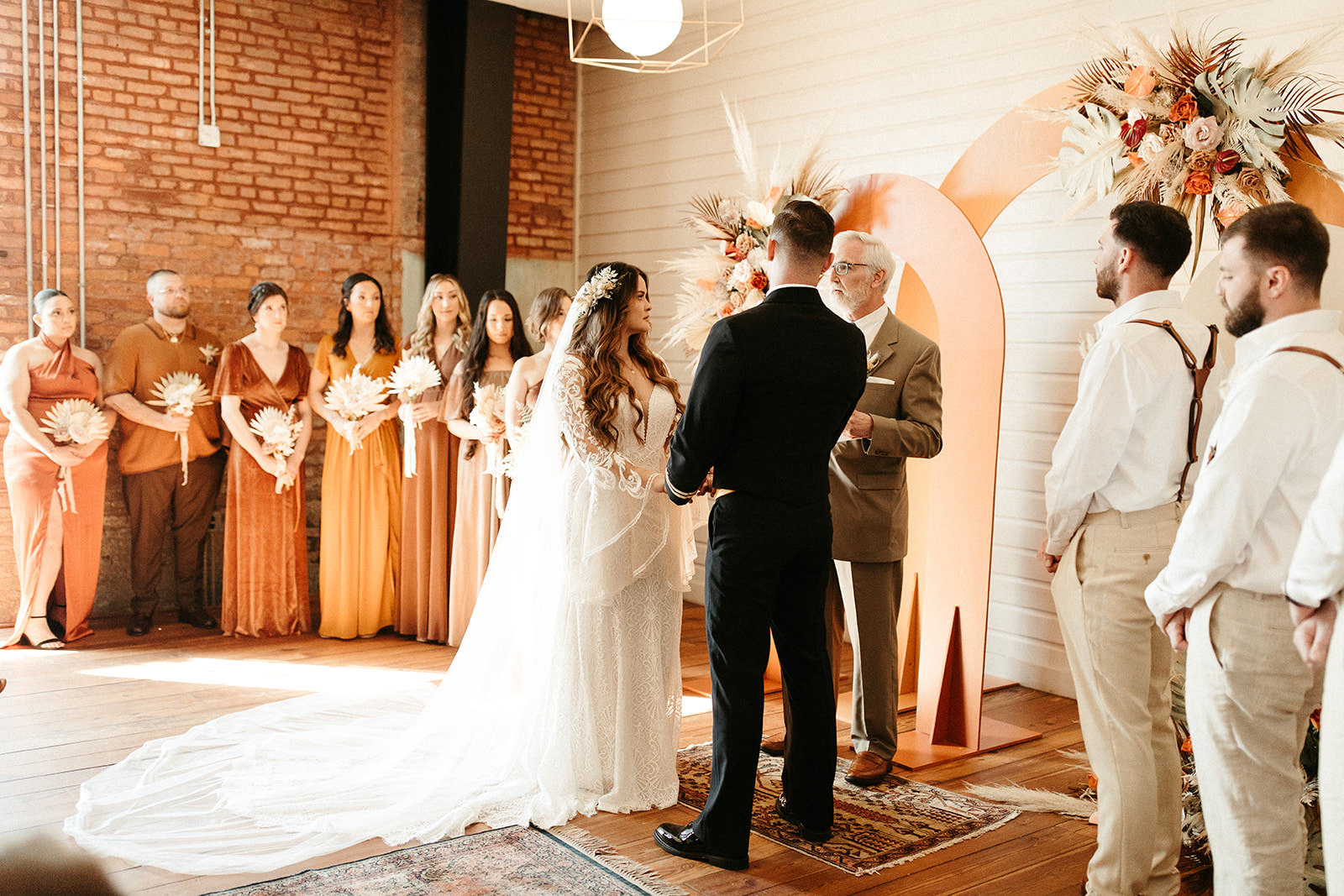 Earthy Neutral Boho Modern Chic Wedding, Bride and Groom Exchanging Wedding Vows | Tampa Bay Wedding Planner Wilder Mind Events | Wedding Florist Save the Date Florida