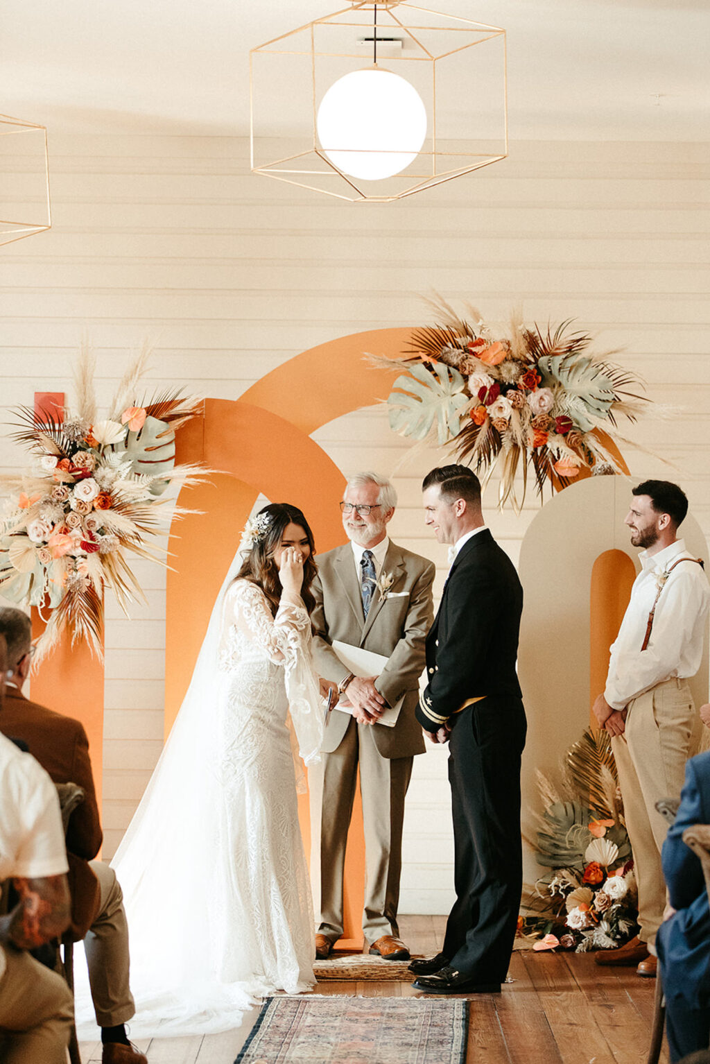 Earthy Neutral Boho Modern Chic Wedding, Emotional Bride and Groom Exchanging Wedding Vows, Arched Terracotta and Cream Panel Backdrops with Lush Floral Bouquets | Tampa Bay Wedding Planner Wilder Mind Events | Wedding Florist Save the Date Florida