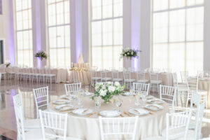 Modern Romantic Wedding Ceremony Decor, Champagne Table Linens, White Chiavari Chairs, Low Greenery and White Roses Floral Centerpiece | Tampa Bay Wedding Venue The Vault