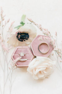 Pink Velvet Ring Box with Cushion Cut Diamond Ring and Gold Wedding Bands