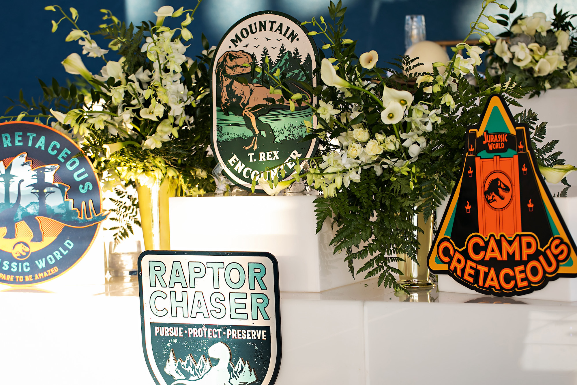 Dinosaur Themed Wedding Décor with White Florals and Greenery | Tampa Florist Bride N Bloom Wholesale and Design