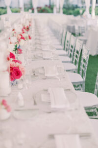 Vintage Southern Classic Wedding Reception Decor, Long Feasting Table with White Floral Linen, Clear Acrylic Chiavari Chairs, Low Pink Floral Centerpieces | Tampa Bay Wedding Planner Parties A'la Carte | Clearwater Beach Wedding Rentals Gabro Event Services, Over the Top Rental Linens | Wedding Florist Bruce Wayne Florals