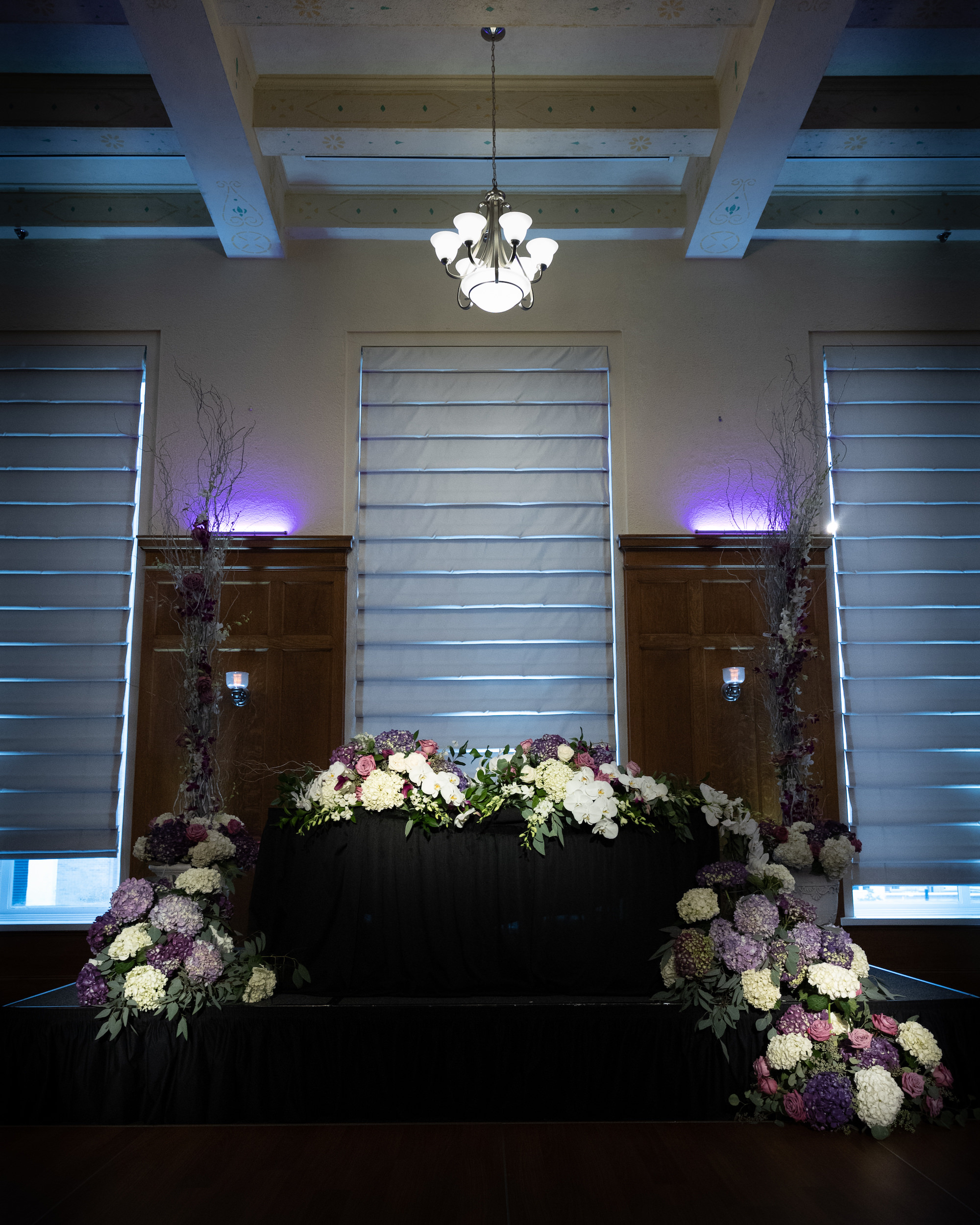 Black and Purple Sweetheart Table with White and Purple Flowers