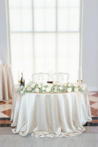 Modern Romantic Wedding Reception Decor, Champagne Silk Table Linen, Greenery and White Roses Floral Garland