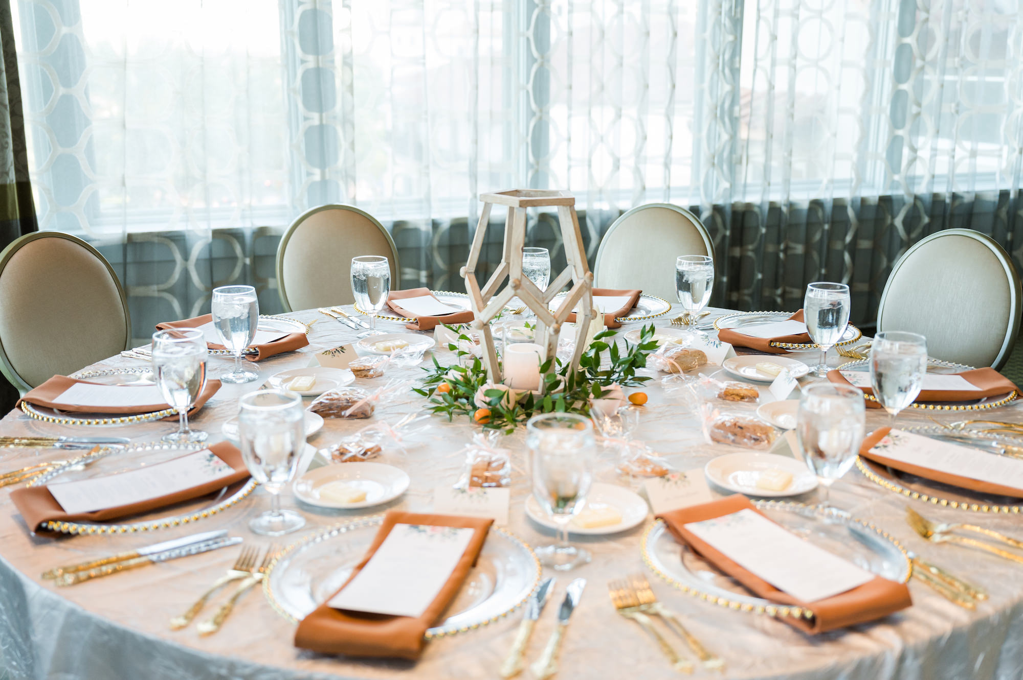 Classic White Linen Reception Tablescape with Greenery and Gold Detail with Peach Napkins and Birchwood Centerpieces | Tampa Bay Wedding Rentals Outside the Box Event Rentals
