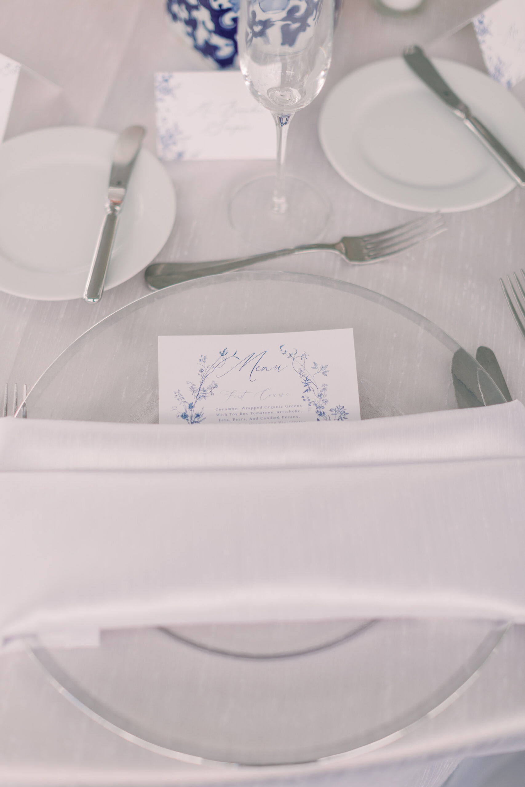 Vintage Southern Classic Wedding Reception Decor, Clear and Silver Rim Charger, White Linen Napkin, Blue and White Stationery | Tampa Bay Wedding Planner Parties A'la Carte | Clearwater Wedding Rentals Over the Top Rental Linens, Gabro Event Services