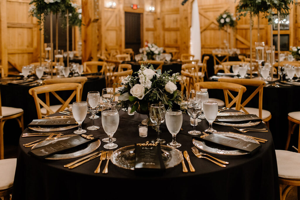 Black Linen Tablescape with Clear Gold Rimmed Charger and White Florals | Tampa Florals FH Events