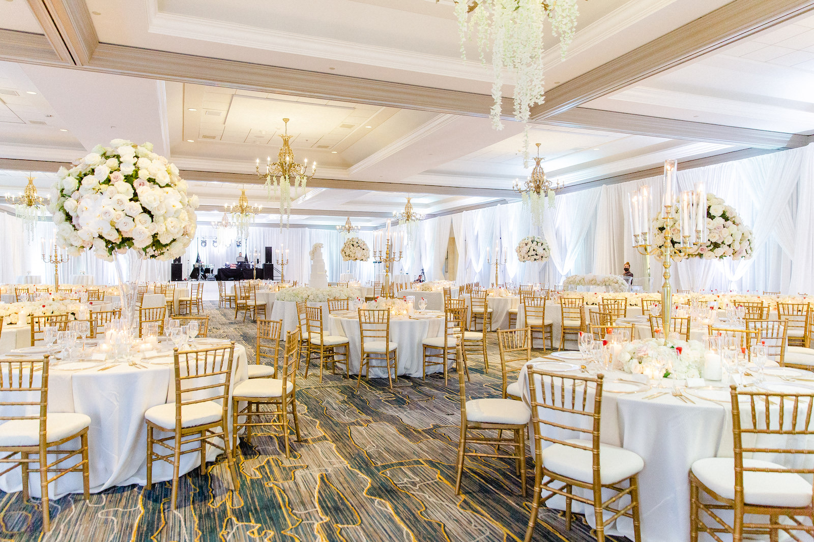 Romantic Elegant White and Gold Wedding, Gold Chiavari Chairs, Tall All Whit3e Floral Bouquets with Roses, Hydrangeas, Hanging White Florals on Chandeliers, White Linen Draping | Tampa Bay Wedding Florist Botanica International Design Studio