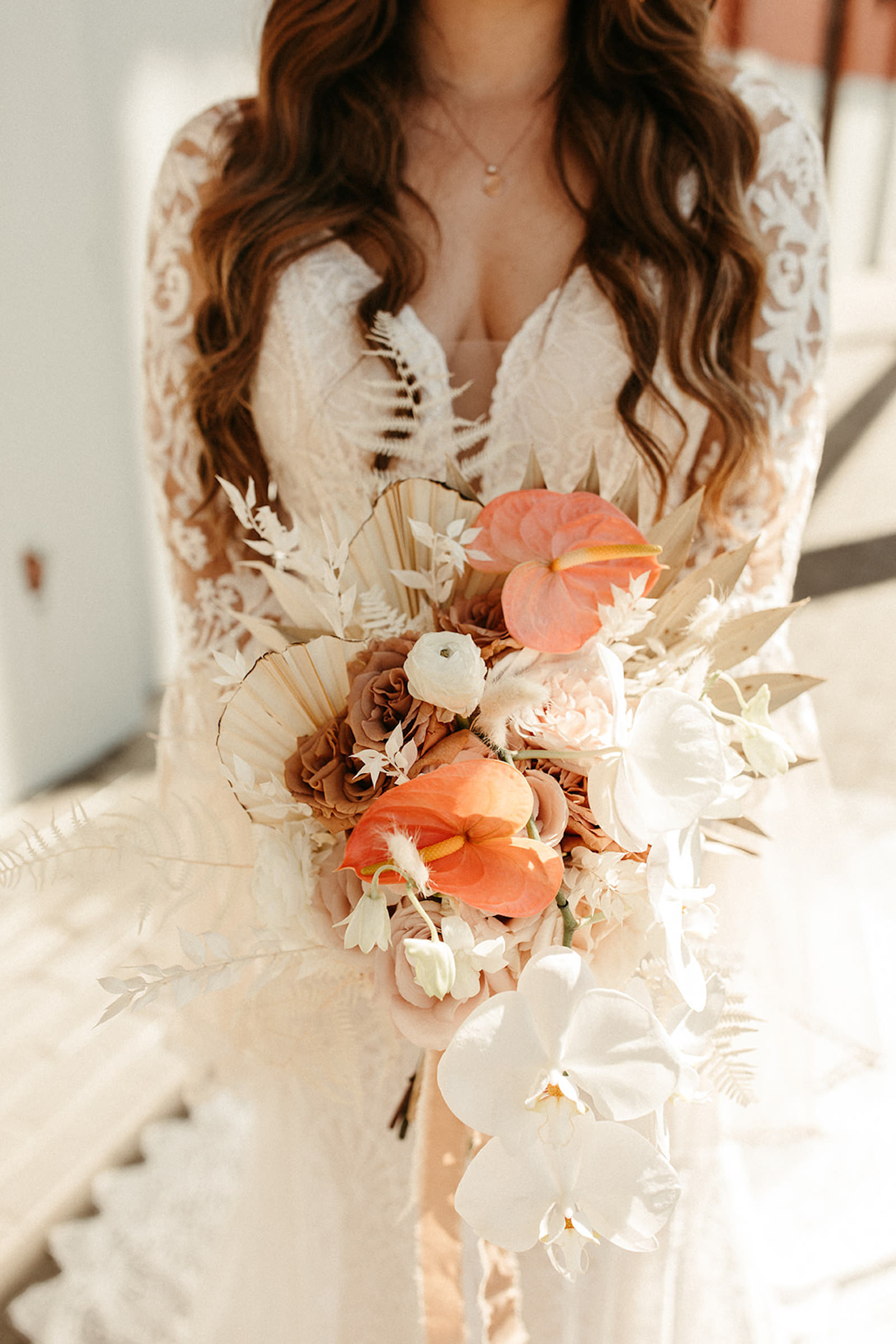 Earthy Neutral Boho Modern Chic Bridal Portrait Holding Lush White Orchids, Tropical Pink Anthurium, Mauve Roses, Dried Leaves Floral Bouquet | Tampa Bay Wedding Florist Save the Date Florida