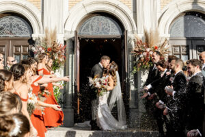 Fall Boho Bride and Groom Greek Wedding Ceremony Confetti Exit at Church Doors | Tampa Bay Wedding Hair and Makeup Femme Akoi Beauty Studio