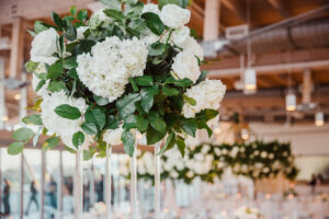 Winter Inspired Wedding Reception, Tall Acrylic Stand with Greenery and Lush White Hydrangeas, Roses Flower Centerpiece | Tampa Bay Wedding Planner MDP Events