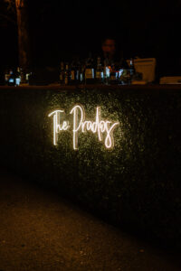 Last Name Neon Sign with Greenery Wall | Tampa Rentals FH Events