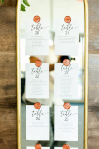 Fall Boho Wedding Ceremony Decor, Gold Mirror with Seating Cards Held by Wax Seals | Tampa Bay Wedding Rentals Gabro Event Services