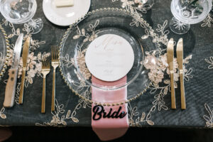 Elegant Reception Ideas | Glass Gold Beaded Wedding Reception Chargers with Round Menu, Gold Flatware, Pink Napkins and Gold Overlay Linen | St. Petersburg Rental Company Outside the Box Event Rentals