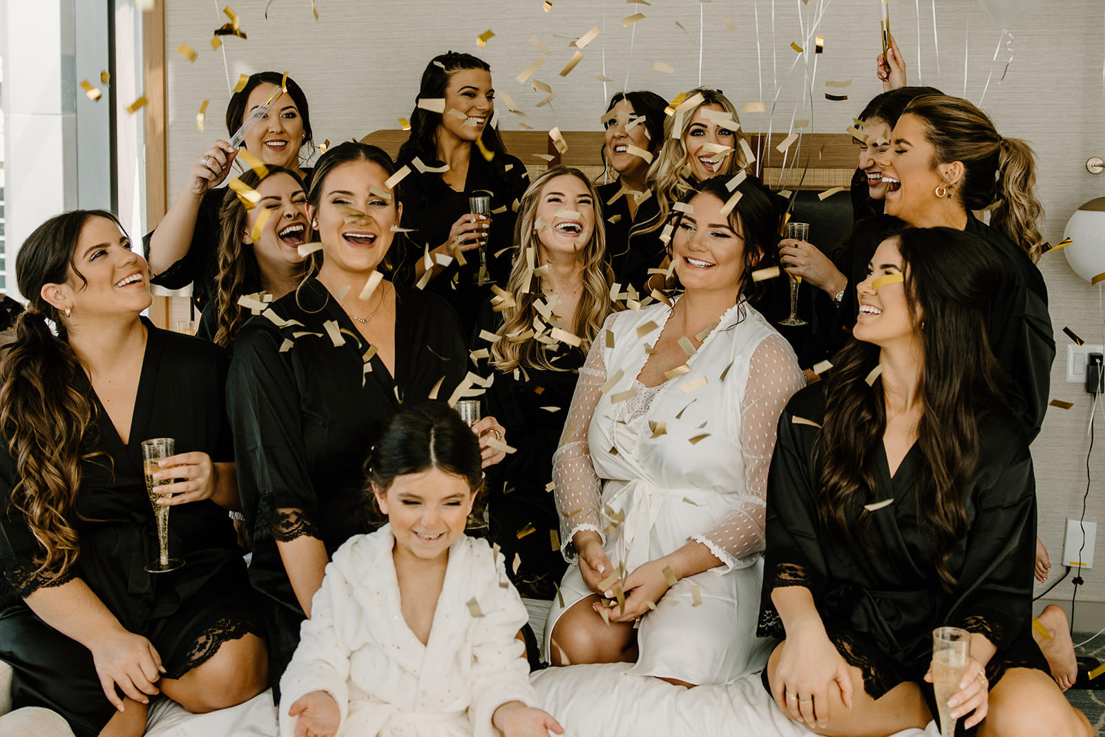 Bride and Bridesmaids Getting Ready with Confetti Portrait | Tampa Hair and Makeup Femme Akoi