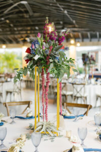 Tall Indigo Floral Centerpieces with Greenery at Crossback Chairs Table | Florida Rentals Kate Ryan Event Rentals