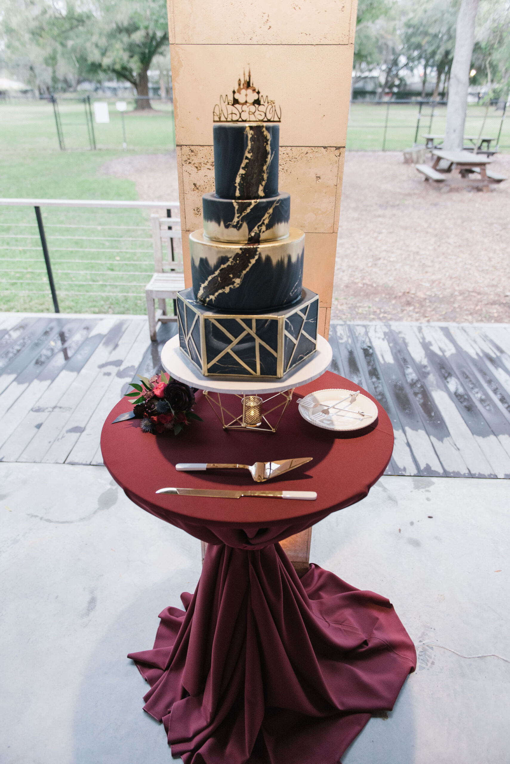 Four Tier Navy Wedding Cake and Gold Trim and Detailing | The Artistic Whisk