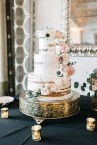 Three Tier Rustic Semi Naked Wedding Cake with Pink Rose Floral Detail and Greenery