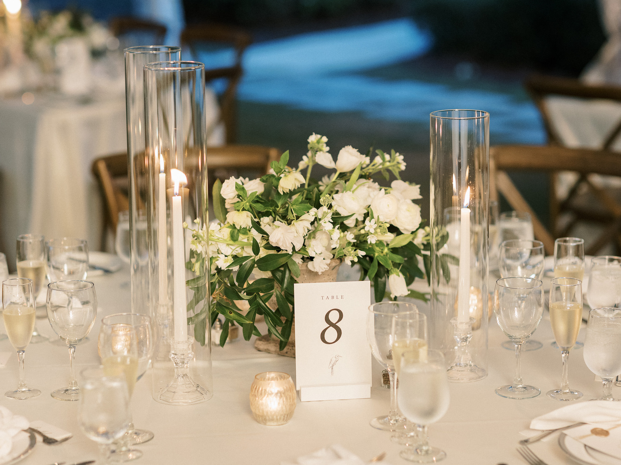 Old Florida Elegant Wedding Reception Decor, Candlesticks in Hurricane Glass Tumblers, Low Greenery and White Floral Centerpiece