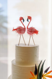 Four Tier Tropical Inspired White Wedding Cake with Flamingo Cake Toppers