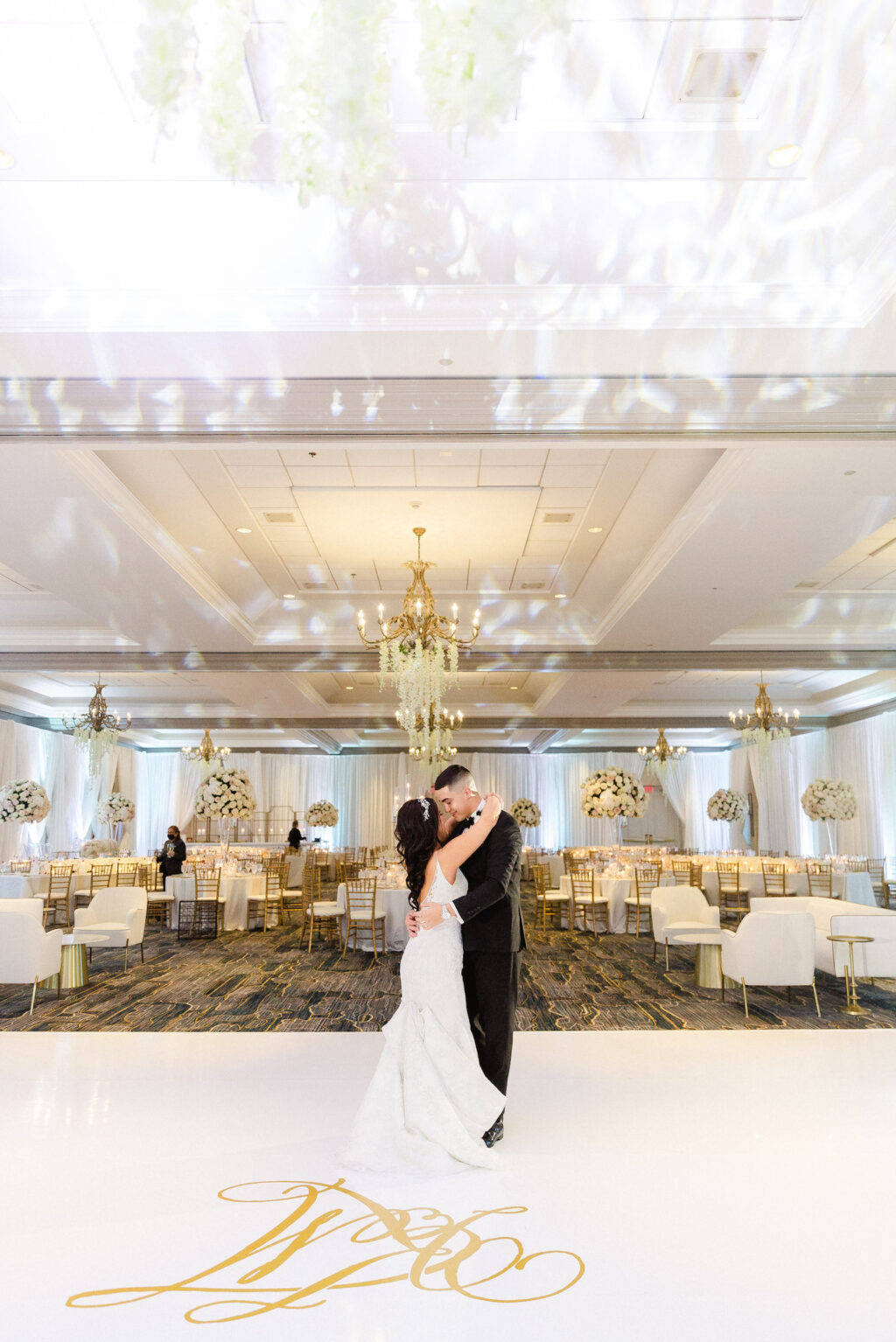 Romantic Bride and Groom First Dance on White Dance Floor with Custom Gold Monogram | Wedding Venue Tampa Marriott Water Street