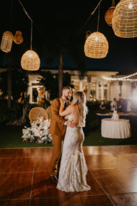 Bride and Groom First Dance Wedding Portrait | Boho Rattan Lighting Reception Dance Floor Inspiration | Island House at Sarasota Wedding Venue Resort at Longboat Key Club