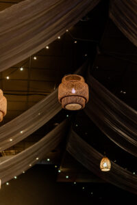 Fall Boho Wedding Reception Decor, Draped Ceiling Linens, Hanging String Lights, Rattan Wicker Chandeliers