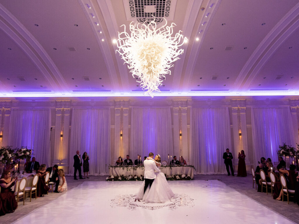 Royal Glam Gatsby Bride and Groom First Dance on White Dance Floor with Custom Gold Monogram | St. Pete Wedding Venue The Vinoy Renaissance