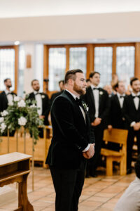 Groom Sees Bride Walk Down the Aisle For the First Time Wedding Portrait